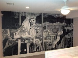 A painting of the white horses on the wall