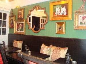 A picture of the dog photo frames on the wall