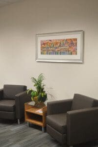 A colorful house painting phot frame on the wall