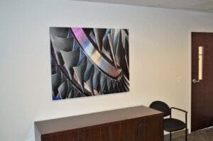 Painting art fixed on the wall above the table