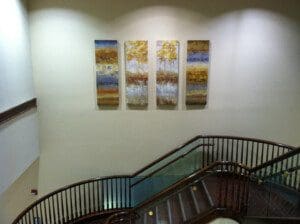 A picture of the wooden railing to the staircase