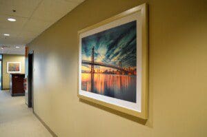 A photo frame on the yellow color wall