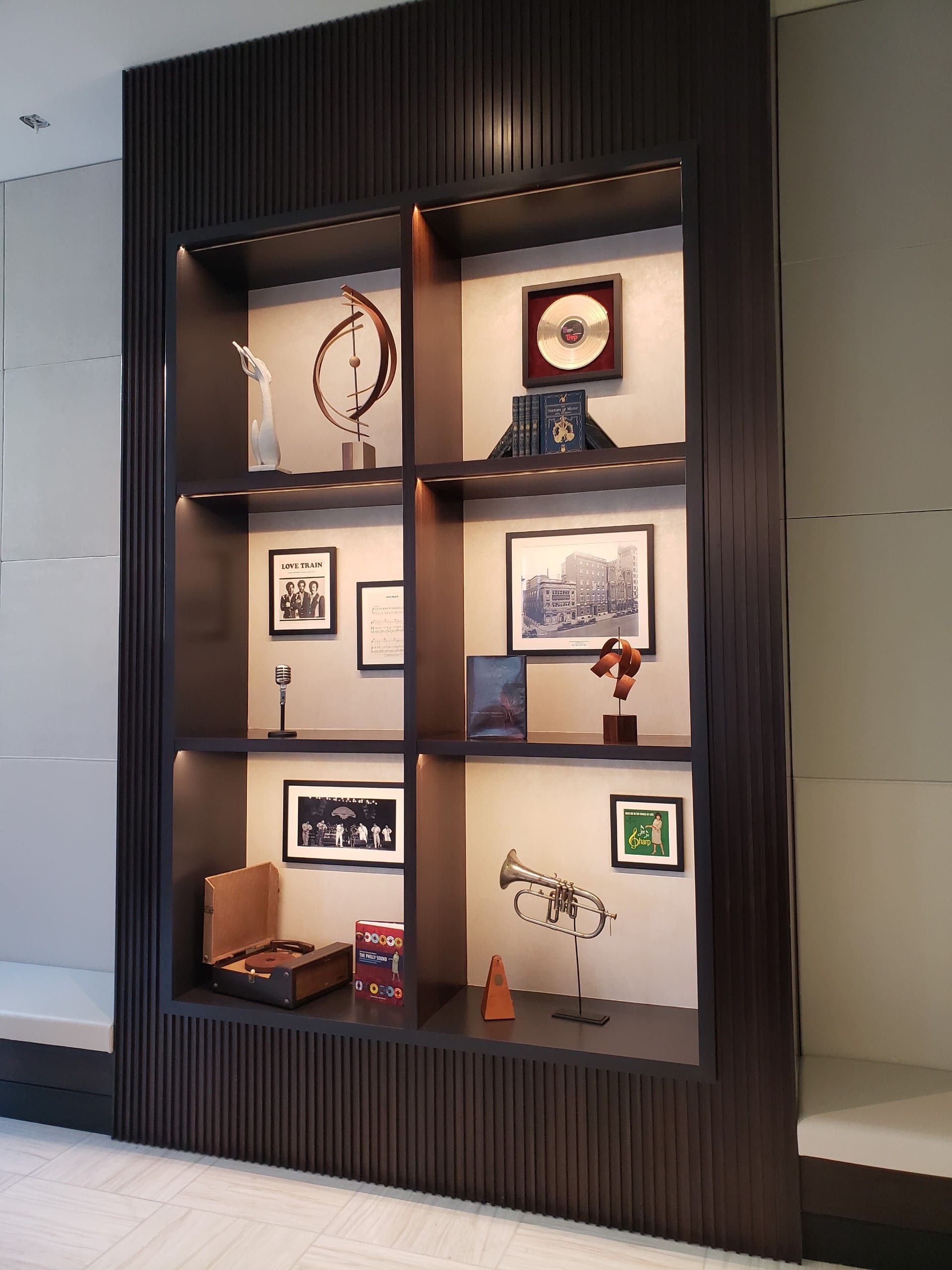 The view of a dark wood panel wall shelve
