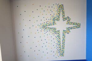 A wall art with colorful pin heads